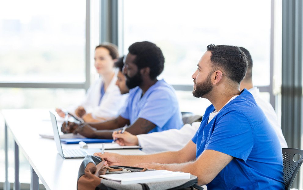 Caregivers taking notes in a classroom