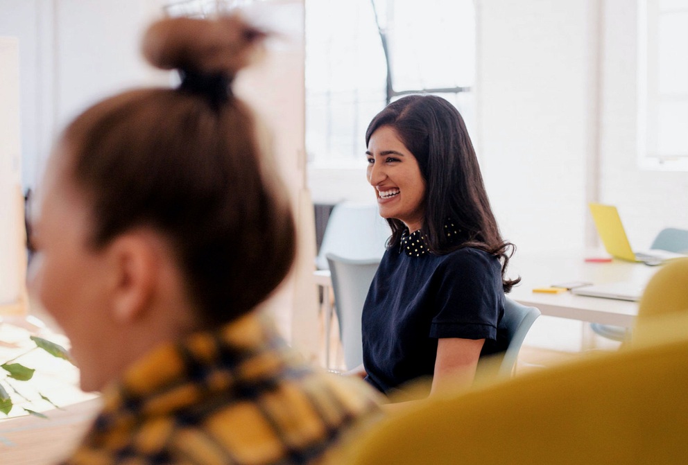 Woman smiling during a meeting