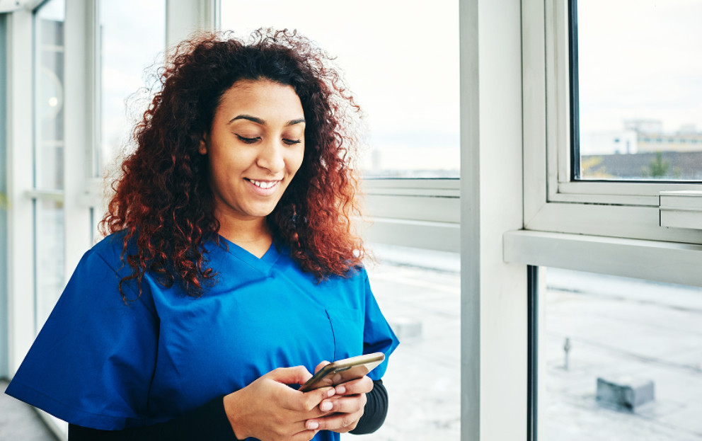 Caregiver using her mobile device